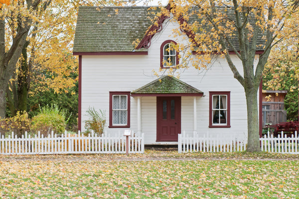 house exterior façade in fall white wood paint 