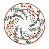 Top view of matching ceramic plate set with green leaf and orange berry botanical pattern, minimalist decorative dinnerware collection
