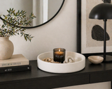 Matte white decorative tray styled on a modern console table with candle, books, vase, and minimalist decor in a contemporary home interior