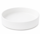 Matte white round decorative tray isolated on a clean background, minimal modern home decor accent piece